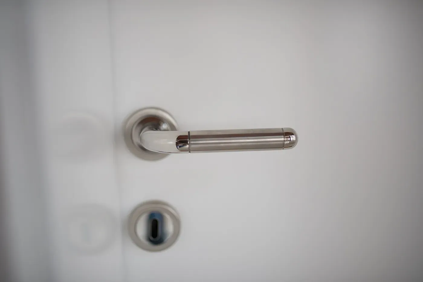 Close-up of a door handle and cylinder
