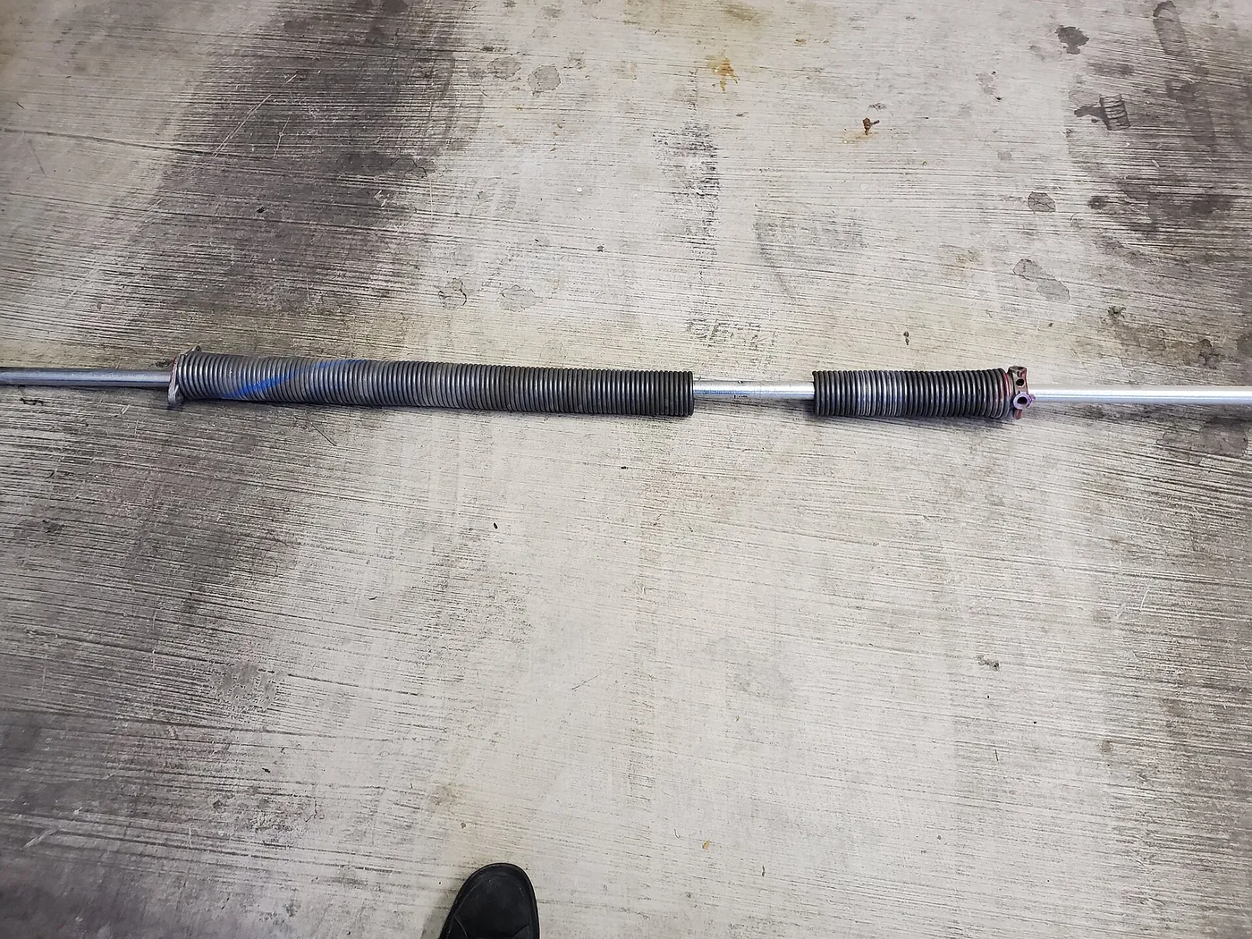 Garage door torsion spring detail — illustrative equipment photograph, not a local job.